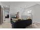 Bright living room featuring a comfortable sofa, a modern TV setup, and stylish decor at 234 N State Ave, Indianapolis, IN 46201