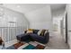 Comfortable living area with a cozy sofa, unique rug, and modern lighting fixtures at 234 N State Ave, Indianapolis, IN 46201
