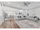 Spacious living room featuring hardwood floors and modern sectional sofa at 234 N State Ave, Indianapolis, IN 46201