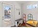 A cozy mud room with a bench, storage, and convenient access to the outdoors at 234 N State Ave, Indianapolis, IN 46201