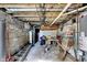 Unfinished basement featuring block walls, exposed ceiling and pipes, and concrete floor at 3329 W 10Th St, Indianapolis, IN 46222