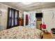 Bedroom featuring an ensuite bathroom and a television at 3329 W 10Th St, Indianapolis, IN 46222