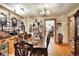 Spacious dining room with hardwood floors, chandelier, and a classic table setting at 3329 W 10Th St, Indianapolis, IN 46222