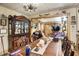 Warm dining room with detailed wood furniture, open to the living area for seamless entertaining at 3329 W 10Th St, Indianapolis, IN 46222