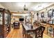 Spacious dining room with hardwood floors, chandelier, and a classic table setting at 3329 W 10Th St, Indianapolis, IN 46222