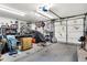 Spacious garage with shelving, storage, and automotive-themed decorations adorning the walls at 3329 W 10Th St, Indianapolis, IN 46222