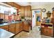 Traditional-style kitchen featuring wood cabinetry, durable countertops, and ample natural light at 3329 W 10Th St, Indianapolis, IN 46222