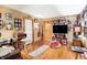 Warm living room featuring hardwood floors, ample lighting, and an inviting atmosphere for relaxation at 3329 W 10Th St, Indianapolis, IN 46222