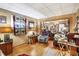 Warm living room featuring hardwood floors, ample lighting, and an inviting atmosphere for relaxation at 3329 W 10Th St, Indianapolis, IN 46222