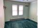 Basic bedroom with green carpet and pastel green walls at 338 A St, Wilkinson, IN 46186