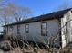 Exterior of single story home with wood siding, windows, dark roof, and dormant foliage at 338 A St, Wilkinson, IN 46186