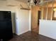 Bright kitchen featuring tiled floor, new black refrigerator, and modern light fixture at 338 A St, Wilkinson, IN 46186