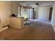 Spacious living room featuring neutral-colored walls, carpeted floor, and large window at 338 A St, Wilkinson, IN 46186