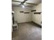 Open living room with a stone fireplace and wood grain ceiling fan at 338 A St, Wilkinson, IN 46186