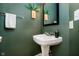 A pedestal sink offers simple elegance within this bathroom at 355 E Ohio St # 116, Indianapolis, IN 46204