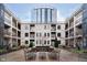 Beautiful building courtyard with seating and landscaping at 355 E Ohio St # 116, Indianapolis, IN 46204
