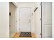 Bright entryway featuring a wooden floor and coat rack at 355 E Ohio St # 116, Indianapolis, IN 46204
