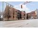 Street view of condo building with brick facade, showcasing urban living at 355 E Ohio St # 116, Indianapolis, IN 46204