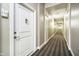 Inviting hallway with neutral walls and modern carpet, leading to unit 116 at 355 E Ohio St # 116, Indianapolis, IN 46204