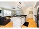 Open-concept kitchen with breakfast bar flowing into a bright and airy living space at 355 E Ohio St # 116, Indianapolis, IN 46204