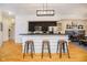 Modern kitchen featuring a breakfast bar with seating and stainless steel appliances at 355 E Ohio St # 116, Indianapolis, IN 46204