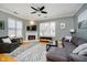 Comfortable living room with a fireplace, large windows, and a cozy sectional sofa at 355 E Ohio St # 116, Indianapolis, IN 46204