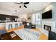 Stylish living room with fireplace open to kitchen and dining room at 355 E Ohio St # 116, Indianapolis, IN 46204