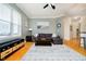 Inviting living room with a cozy sectional, hardwood floors, and natural light at 355 E Ohio St # 116, Indianapolis, IN 46204