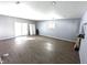 Open floor plan featuring new floors, sliding glass doors, and neutral paint at 401 W Edwards Ave, Indianapolis, IN 46217