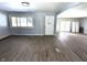 Living space featuring neutral paint, new floors, and a white front door at 401 W Edwards Ave, Indianapolis, IN 46217
