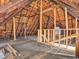 Spacious attic featuring exposed wood beams, natural light, and potential for renovation or additional storage at 422 E Main St, Lebanon, IN 46052
