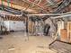 Unfinished basement offering ample space for storage, utilities, and potential customization or renovation at 422 E Main St, Lebanon, IN 46052