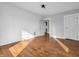 Empty bedroom features hardwood floors and white walls with a doorway view to the bathroom at 422 E Main St, Lebanon, IN 46052