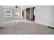 Spacious bedroom featuring carpeted floors, large windows, and a classic ceiling fan at 422 E Main St, Lebanon, IN 46052