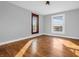 Bedroom features hardwood floors, two windows, and neutral color palette at 422 E Main St, Lebanon, IN 46052