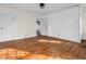Light-filled bedroom featuring hardwood floors, neutral paint, and attached bath at 422 E Main St, Lebanon, IN 46052