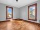 Bedroom with hardwood floors, gray walls, and natural lighting at 422 E Main St, Lebanon, IN 46052