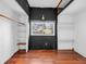 Spacious closet with hardwood floors, shelves, and a window overlooking the neighborhood at 422 E Main St, Lebanon, IN 46052