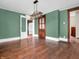 Dining room featuring hardwood floors, a modern light fixture, and vintage trim at 422 E Main St, Lebanon, IN 46052