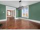 Cozy dining room with hardwood floors, modern lighting, and vintage-style trim at 422 E Main St, Lebanon, IN 46052