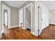 Spacious hallway features hardwood floors and white trim around doorways at 422 E Main St, Lebanon, IN 46052