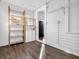 Mud room features storage shelves, white cabinets, and views into the kitchen area at 422 E Main St, Lebanon, IN 46052
