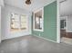 Enclosed porch area with multiple windows, vintage trim, and neutral interior at 422 E Main St, Lebanon, IN 46052