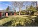 Expansive backyard with lush green lawn and mature trees, perfect for outdoor activities at 426 Oakwood Dr, Indianapolis, IN 46260