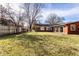 Large, green backyard with a privacy fence and plenty of space for outdoor activities at 426 Oakwood Dr, Indianapolis, IN 46260
