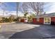 Expansive backyard with ample parking, a shed, and a sliding glass door entrance at 426 Oakwood Dr, Indianapolis, IN 46260