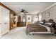 Bedroom featuring twin beds, ceiling fan, and a dresser with mirror, and an adjacent sitting area at 426 Oakwood Dr, Indianapolis, IN 46260