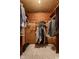 Walk-in closet with clothing racks, shelves, and shoes neatly arranged on the floor at 426 Oakwood Dr, Indianapolis, IN 46260