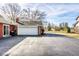 Long driveway leading to a two-car garage, set against a serene neighborhood backdrop at 426 Oakwood Dr, Indianapolis, IN 46260