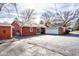 View of the house with a detached garage and a private driveway at 426 Oakwood Dr, Indianapolis, IN 46260